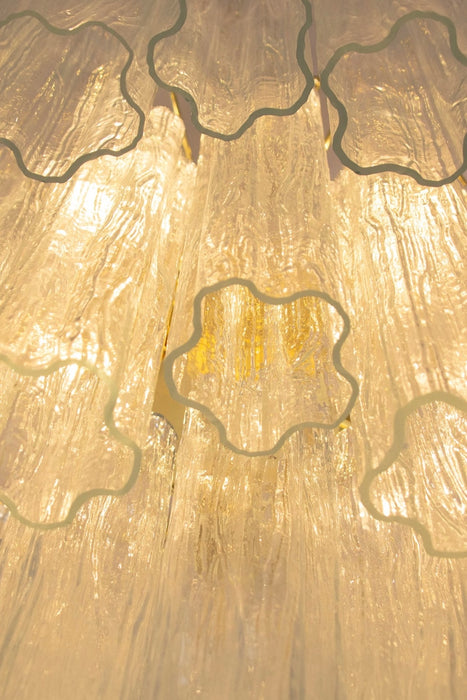 Smuk ny italiensk Murano Tronchi lysekrone med krom/stål stel.   Lysekronen består af 48 mundblæste Tronchi prismer / glasstave i transparent krystal glas sat på metalstel. Den har 5 x E14 fatning og giver masser af lys. Håndlavet i Italien. Længde på kæde kan justeres ved at aftage led. 