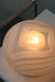 Vintage Murano bordlampe i matteret glas med gule undertoner og messing bund. Lampen giver et meget hyggeligt lys. Håndlavet i Italien, 1970erne. D:22 cm H:16 cm 